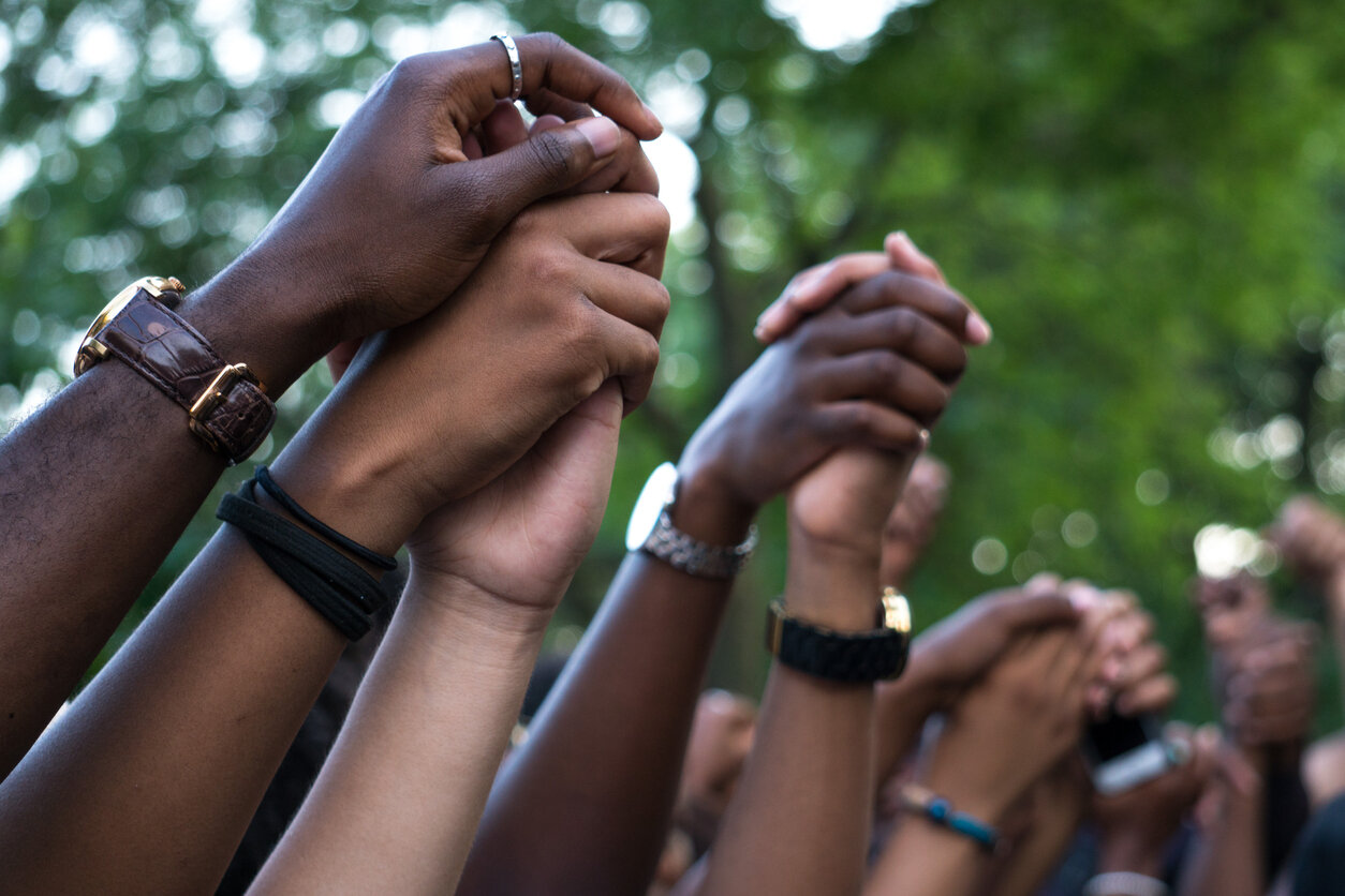 Montreal, Canada - July 13, 2016: On the hottest day of the summer (37 C), hundreds of protesters gathered at Nelson Mandela Park for a Black Lives Matter rally, in solidarity to similar protests in the United States, and to condemn the racial profiling and police brutality in Montreal. After the rally, the protesters took the streets and marched down for three hours and about 10 km. The march finished around 10pm without incident.